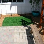 grass Here is a cobblestone patio installed with a small lawn in Santa Rosa.